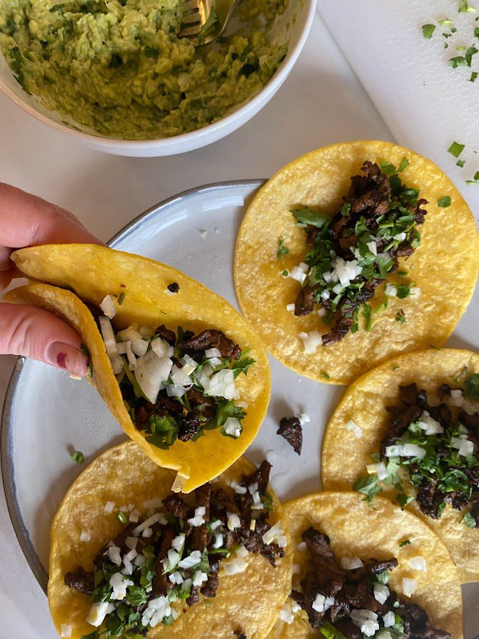 Repurposed leftover steak to a delicious carne asada street taco recipe. Great idea for how to use leftovers.